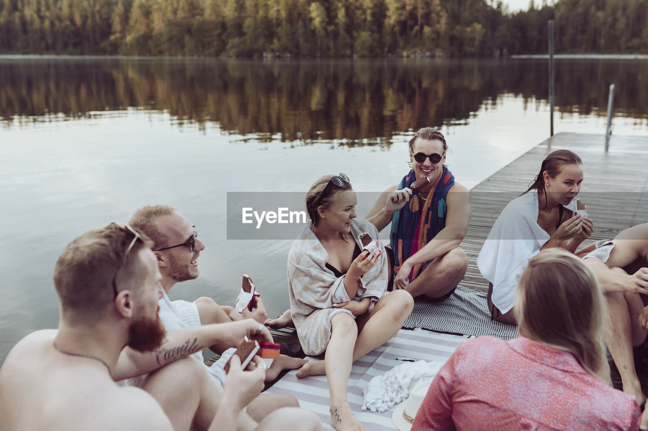 Friends relaxing at lake