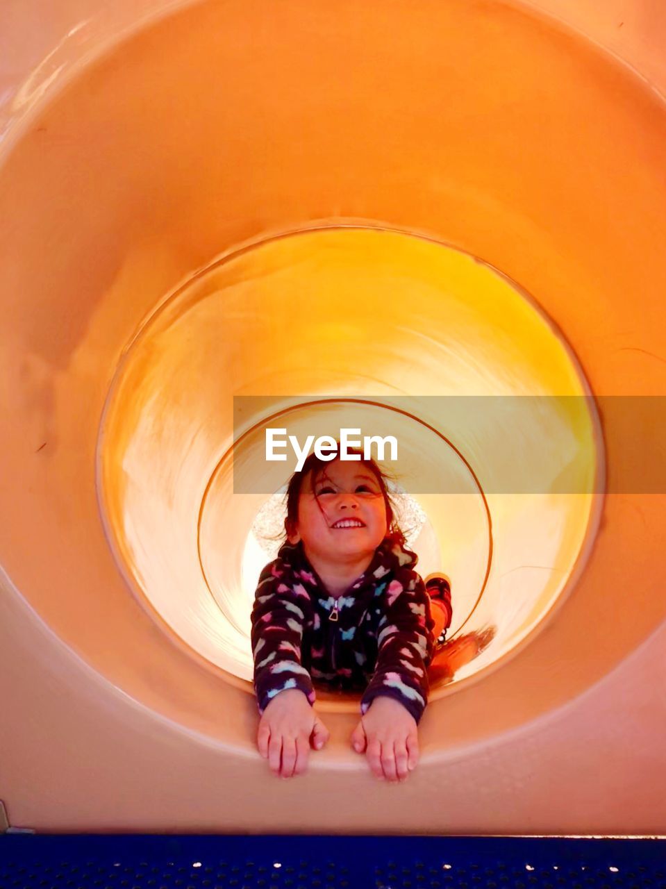 Girl playing in slide