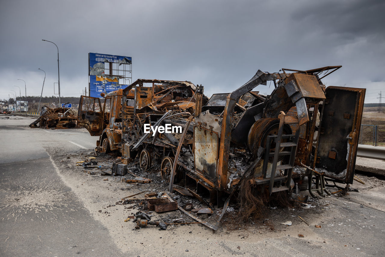 Military vehicles that burned down after being hit by a shell.