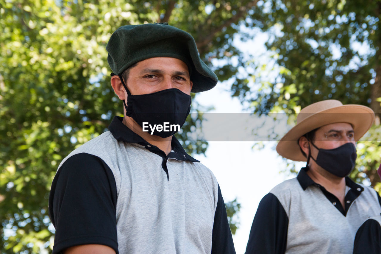 Argentinian traditional gauchos with face mask