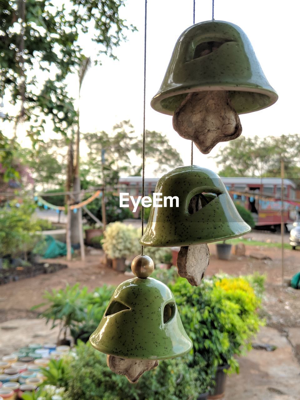 CLOSE-UP OF OLD LAMP HANGING AGAINST SKY