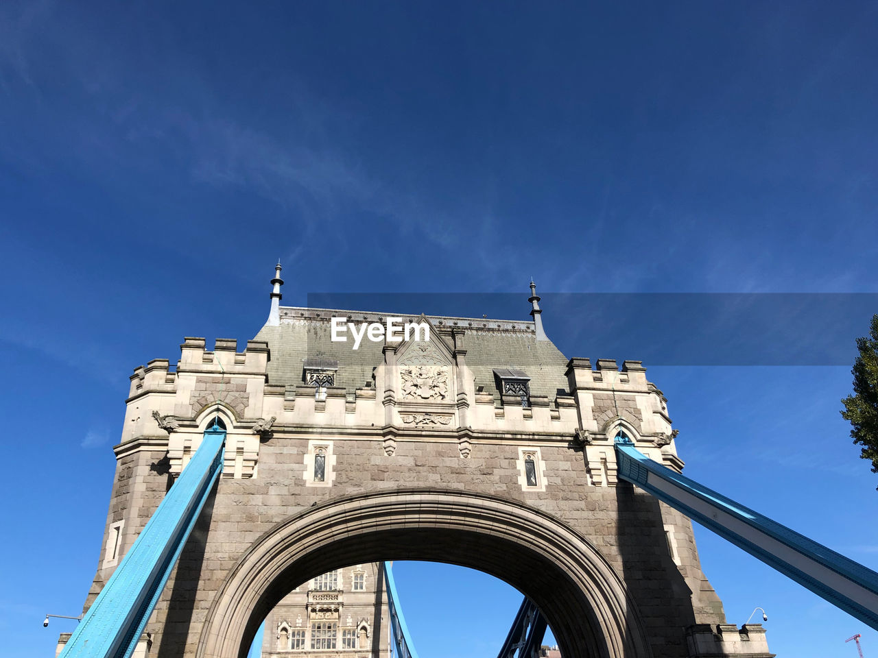 Low angle view of historical building against blue sky