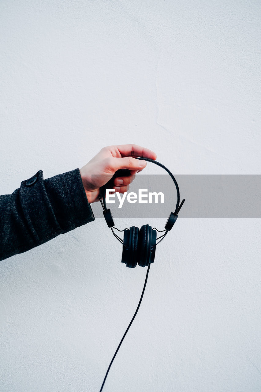 Woman holding headphones