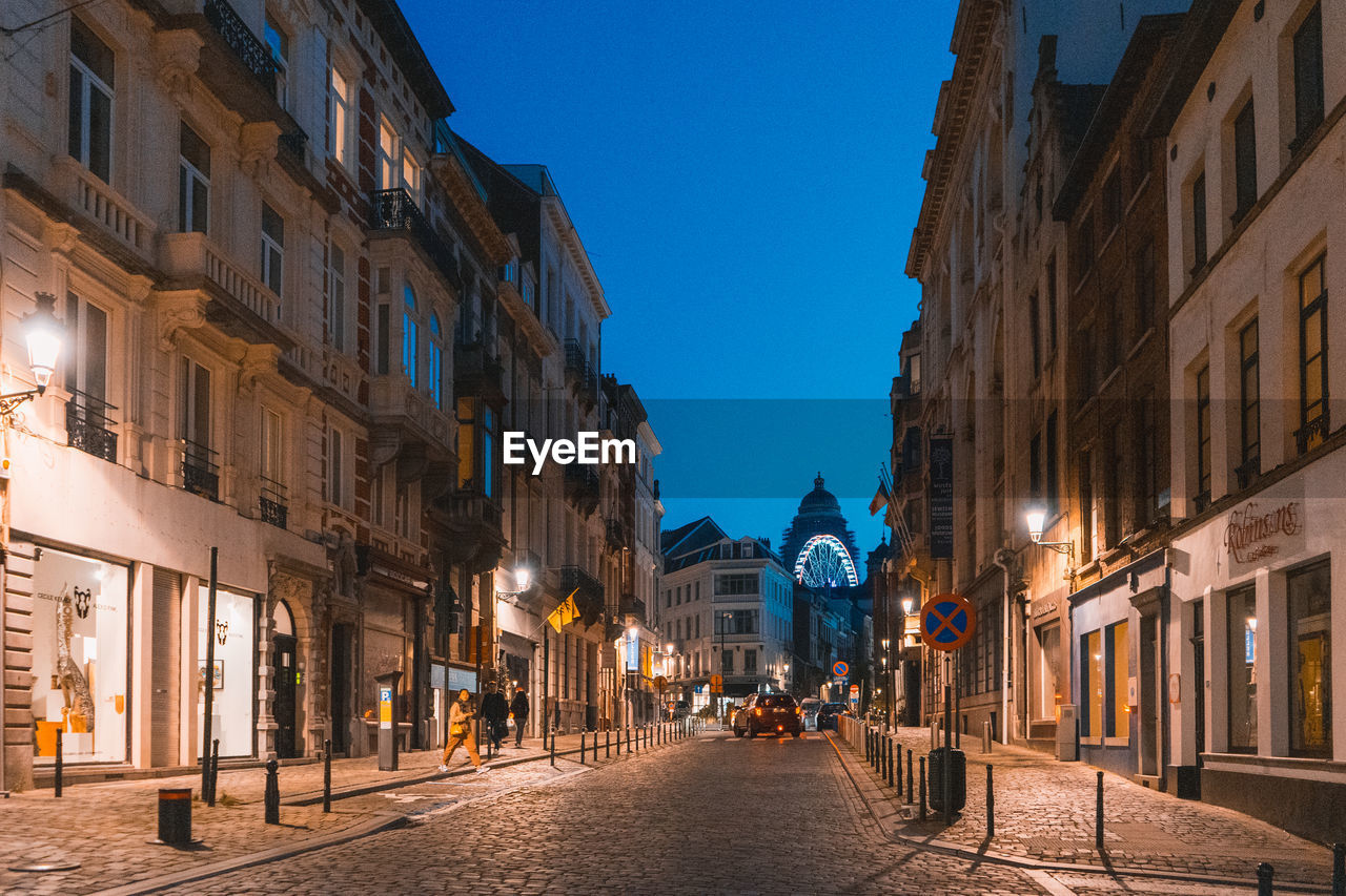 Nightlife in brussels. people strolling through the streets of belgiums capital