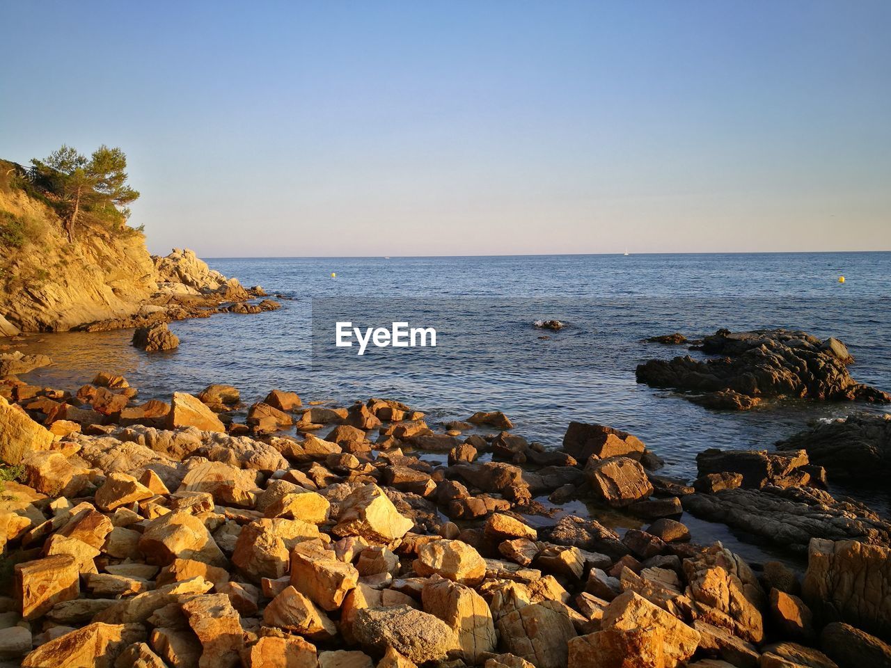 Scenic view of sea against clear sky