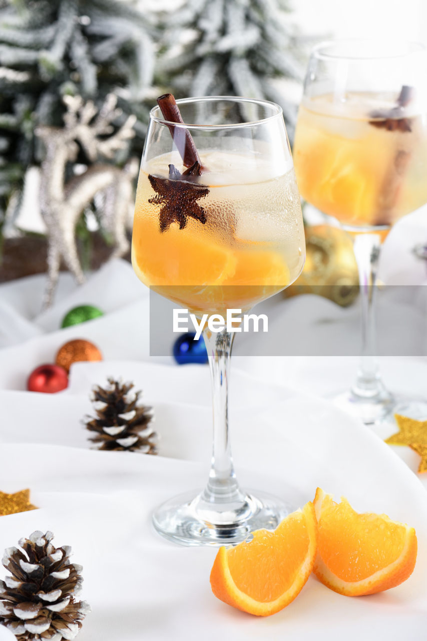 Light christmas spritzer made with orange juice and vodka. the cocktail to start your holiday party