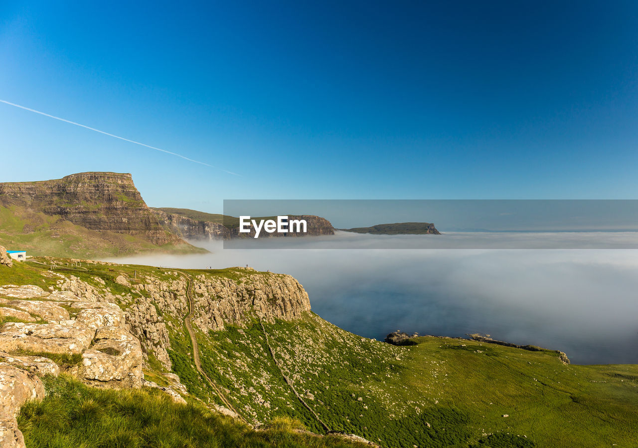 Scenic view of sea against clear blue sky