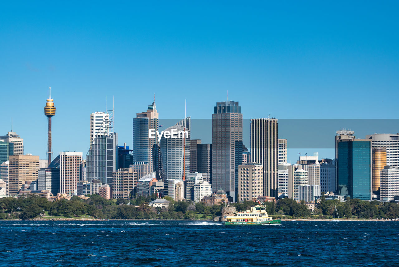 Sydney central business district cityscape with ferry boat. modern urban skyline, smart city 