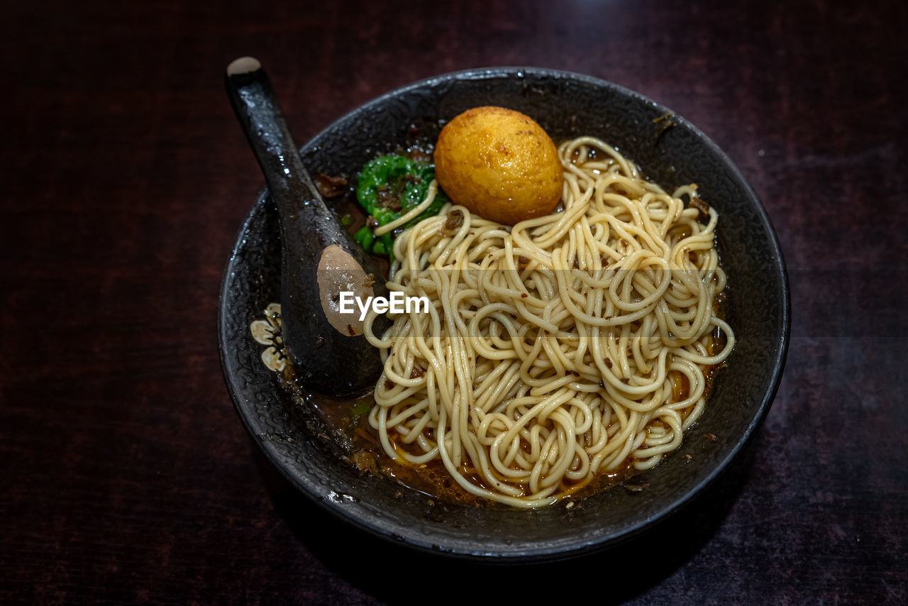 pasta, food, food and drink, italian food, healthy eating, freshness, dish, indoors, noodle, wellbeing, wood, no people, spaghetti, cuisine, table, vegetable, plate, meal, asian food, kitchen utensil, still life, bowl, fried, studio shot, high angle view, crockery, dark