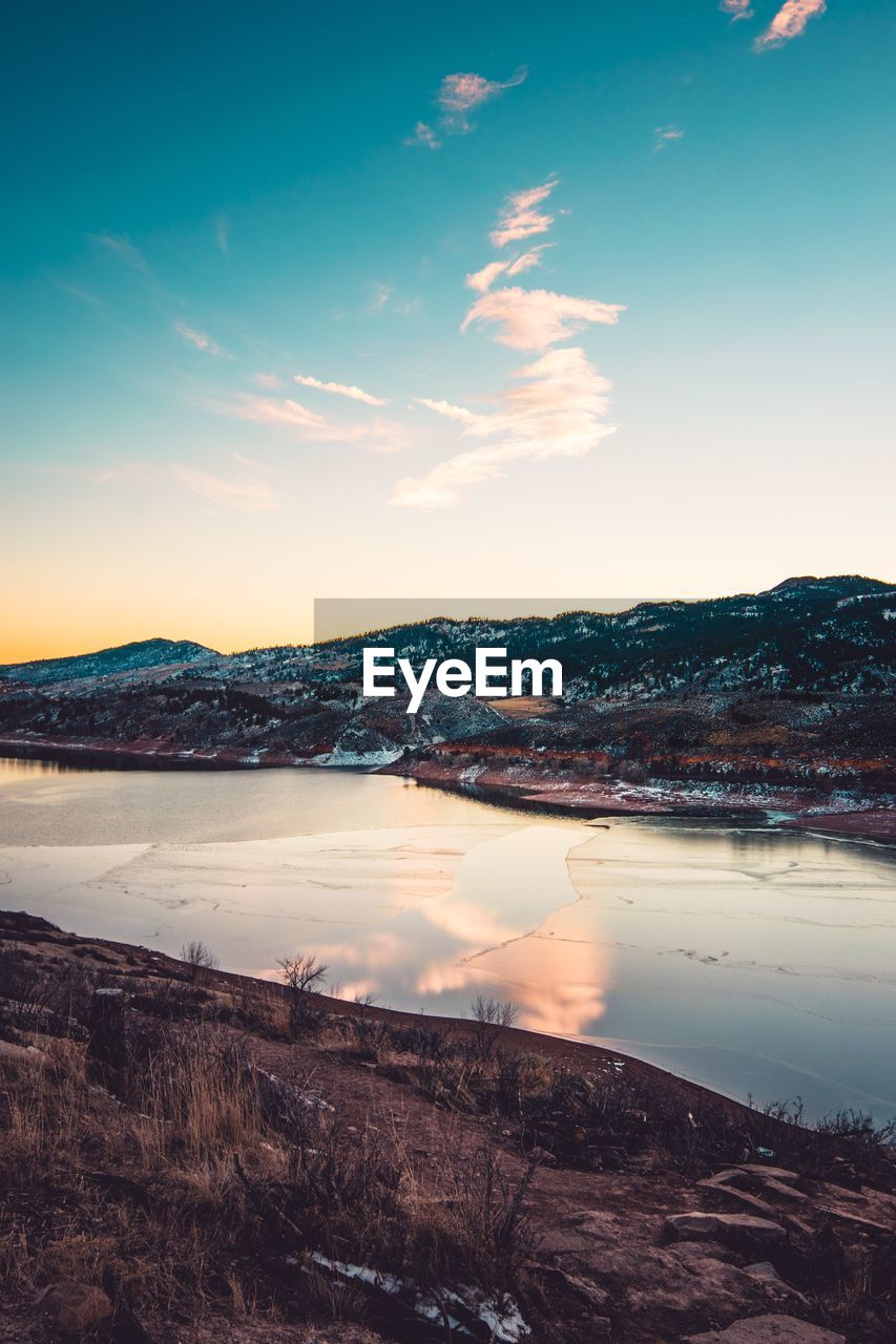 Scenic view of landscape against sky during sunset