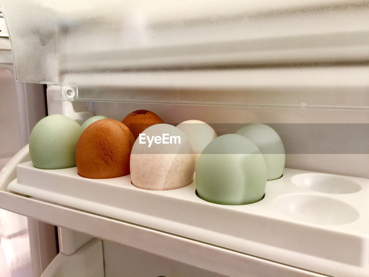 Close-up of eggs arranged in refrigerator