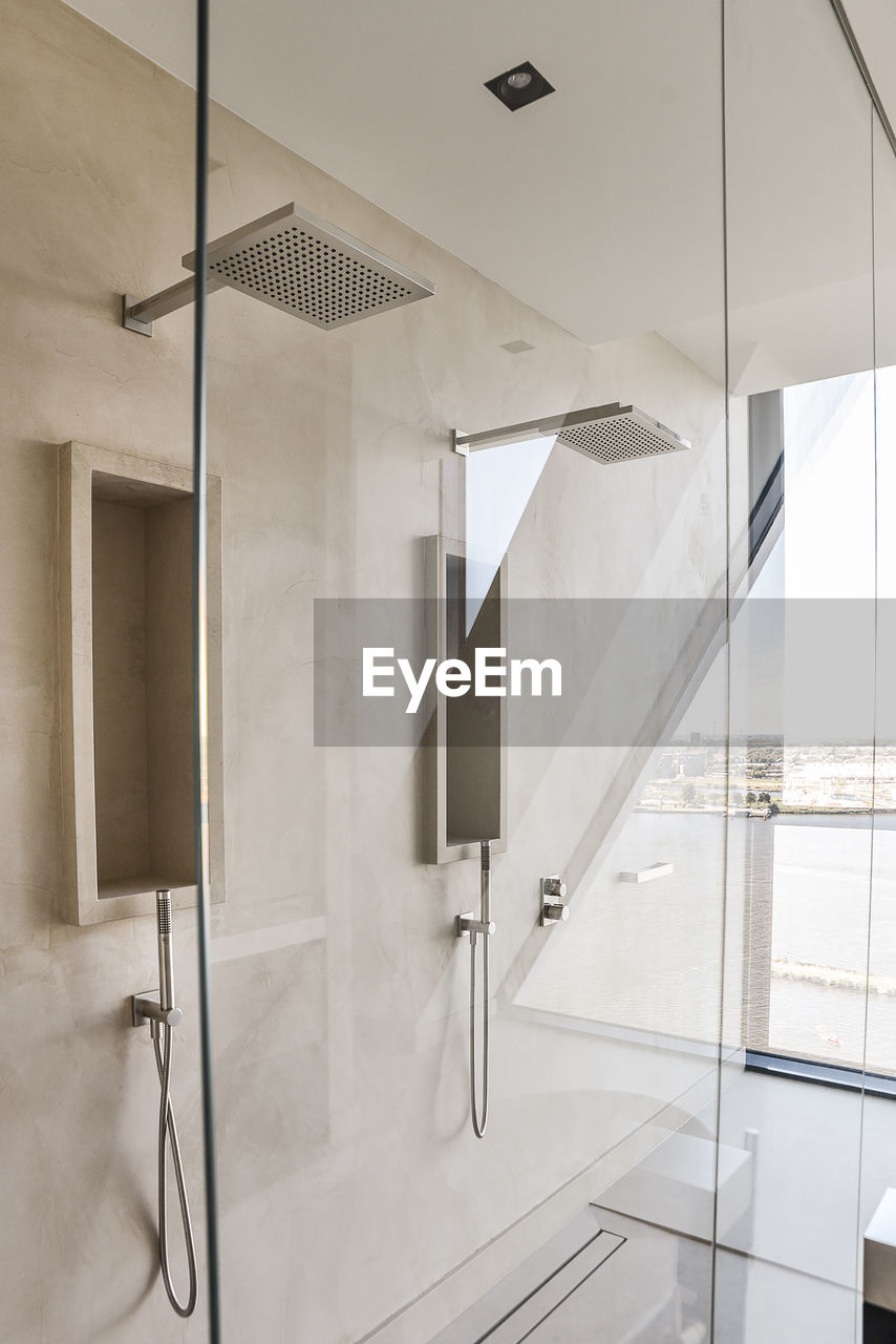 Modern shower cubicle in empty bathroom