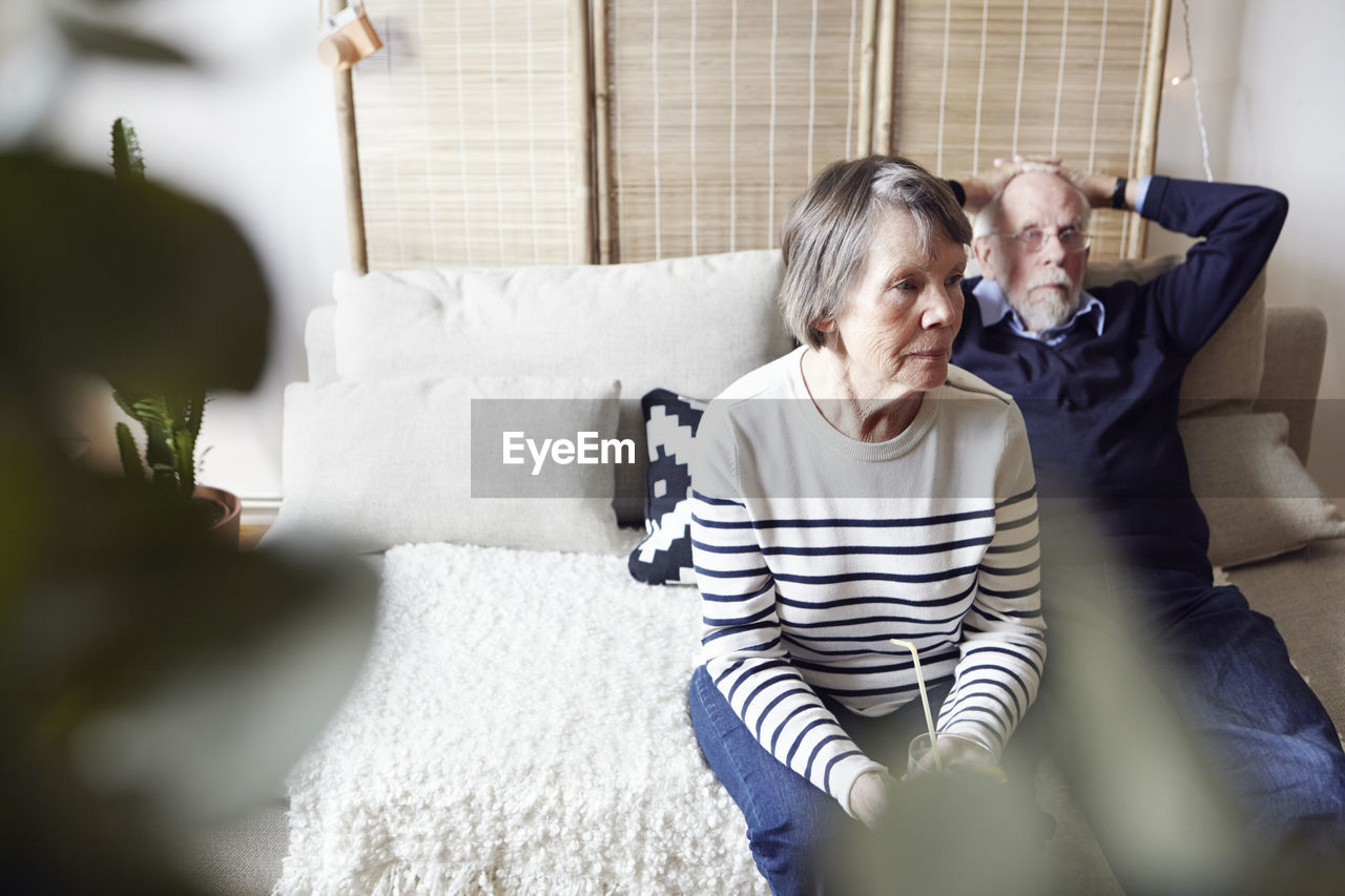 Senior couple sitting in living room