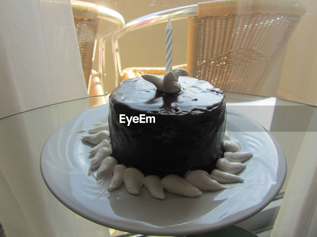 CLOSE-UP OF CAKE IN PLATE WITH FORK