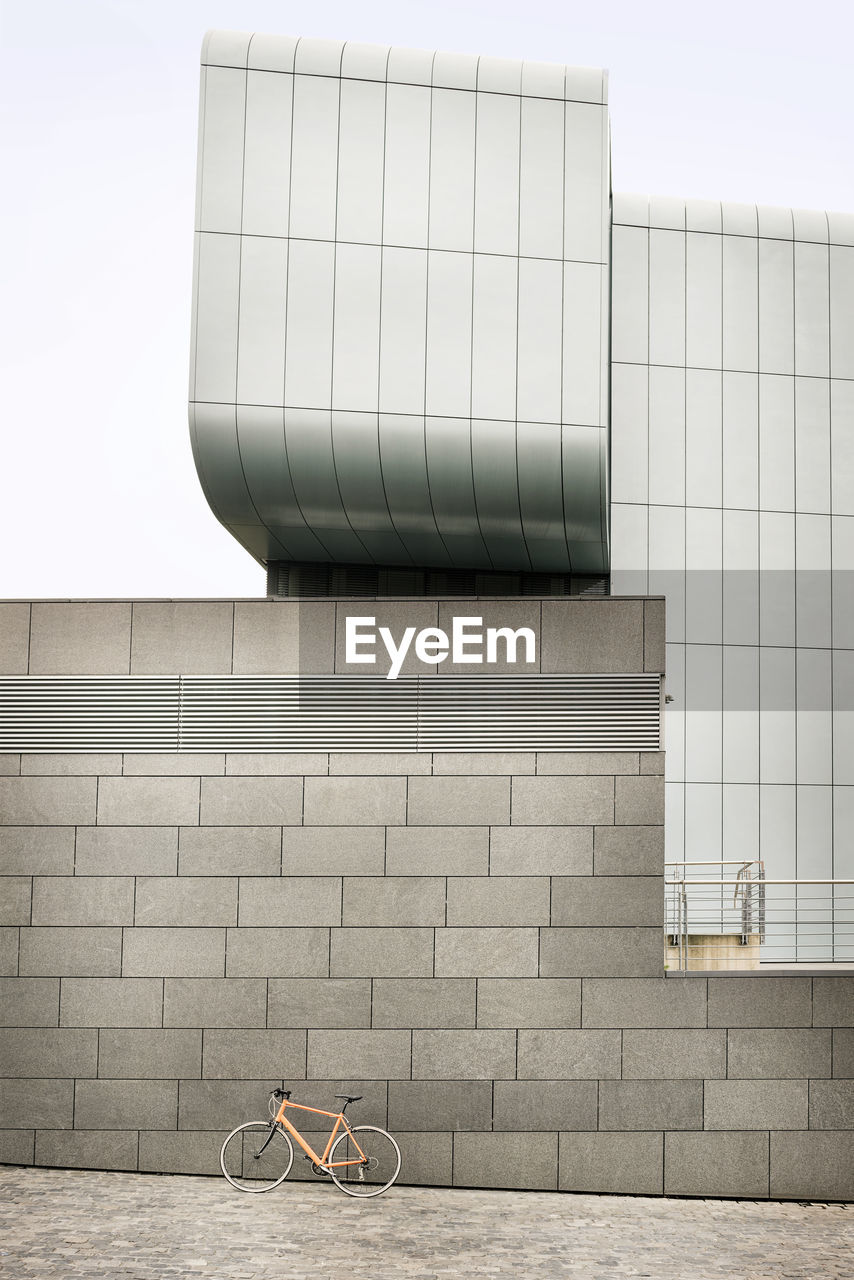 Bicycle at a wall in the city