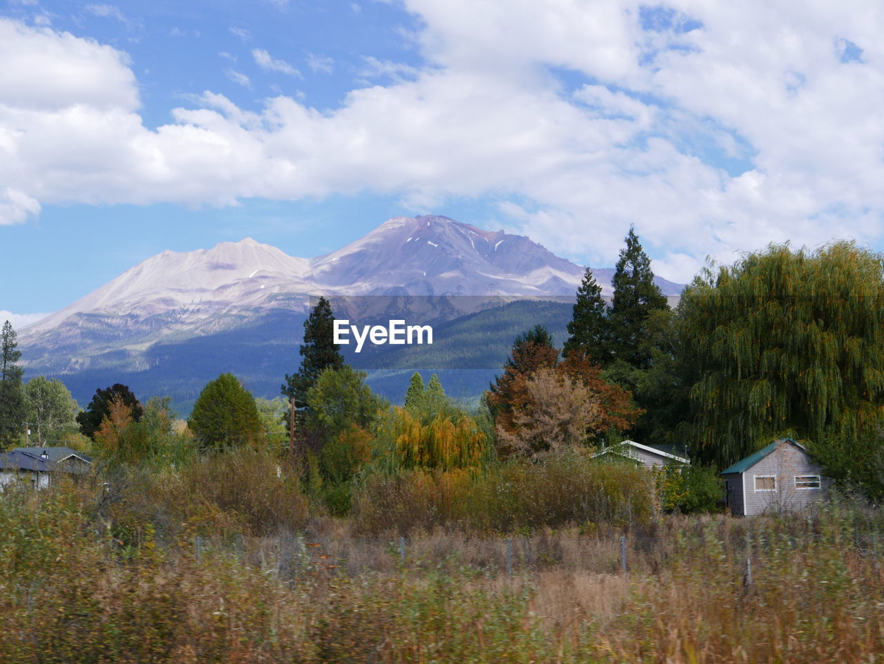 Scenic view of mountains against cloudy sky