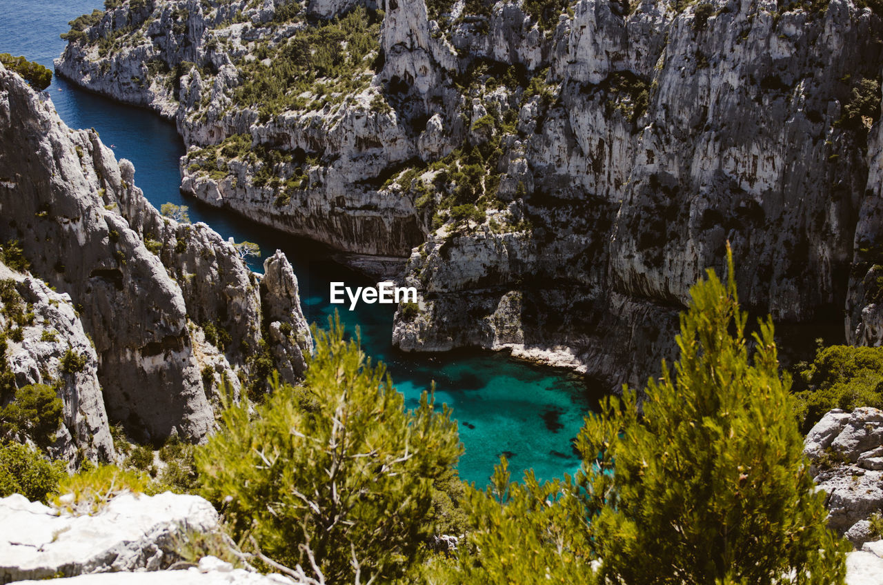 High angle view of rock formation by sea