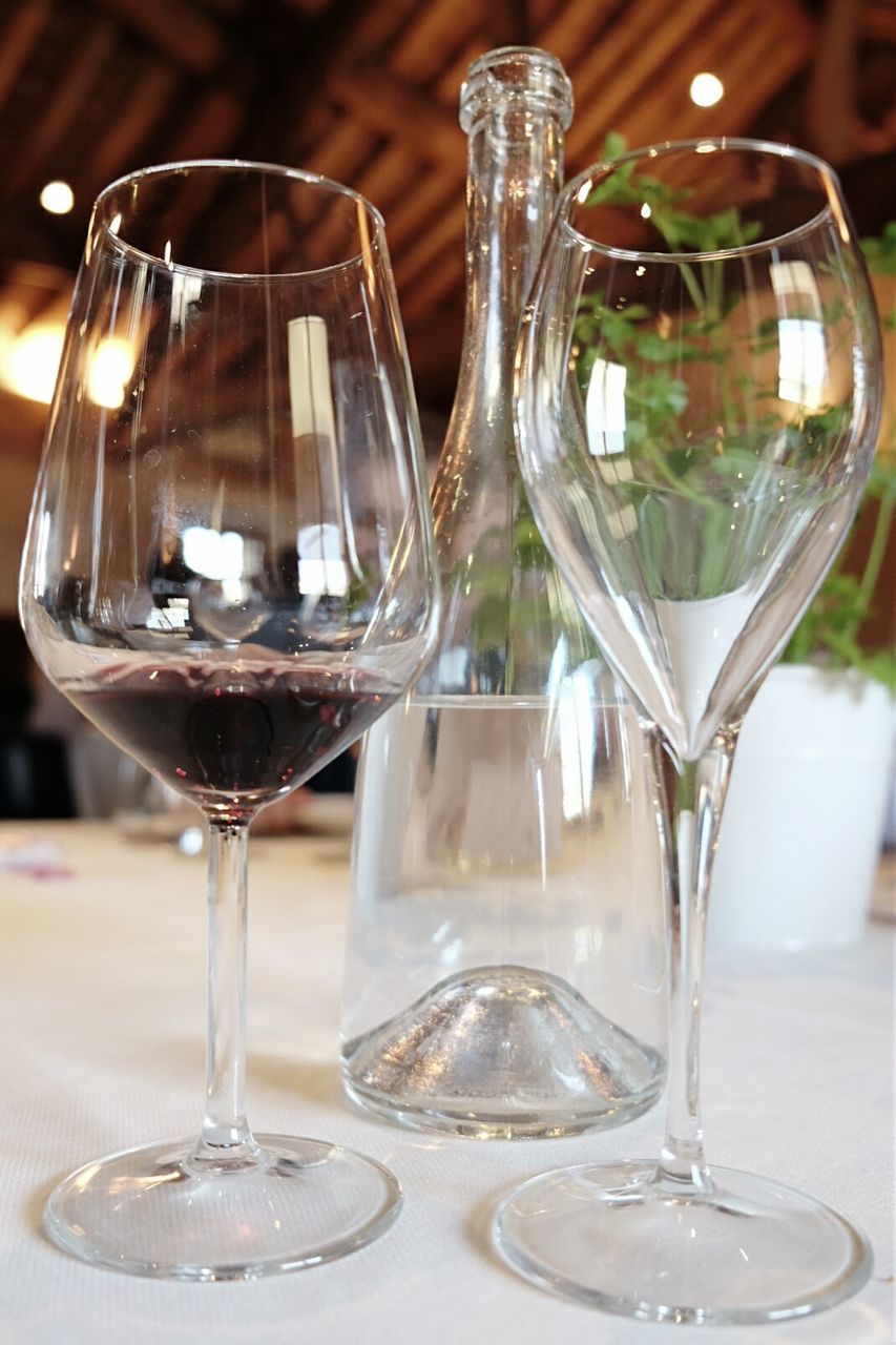 Close-up of wine glasses on table