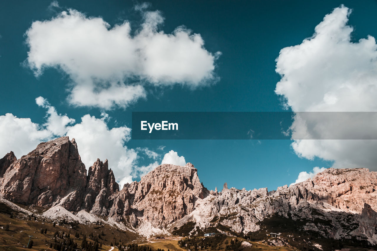 Low angle view of rocks against sky