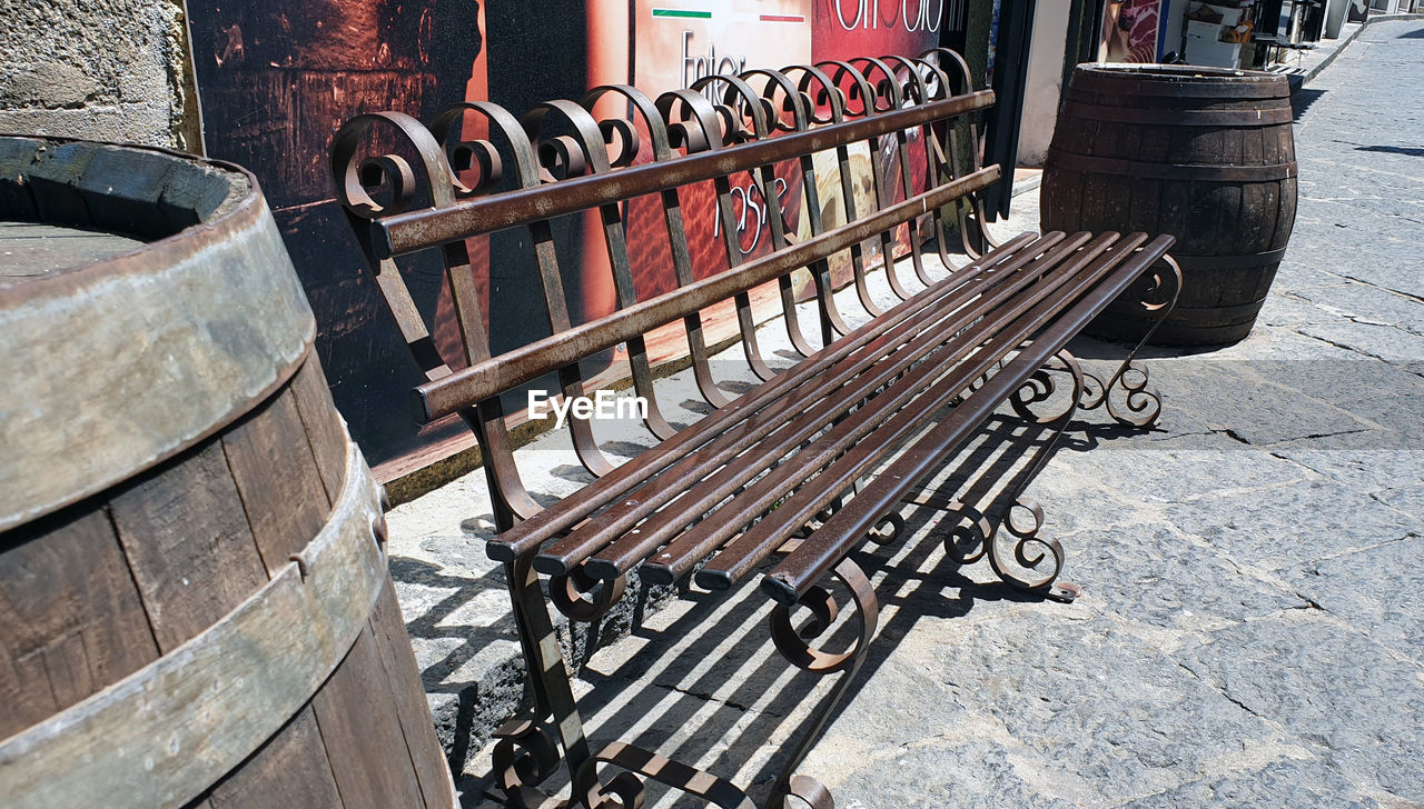 HIGH ANGLE VIEW OF EMPTY CHAIRS ON STREET