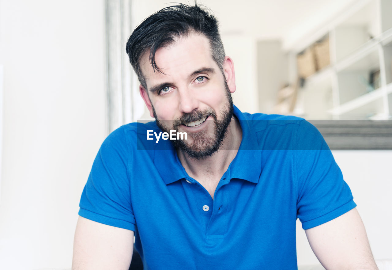 Portrait of smiling man at home