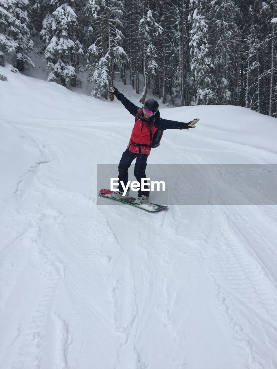 FULL LENGTH OF SENIOR MAN ON SNOWY FIELD