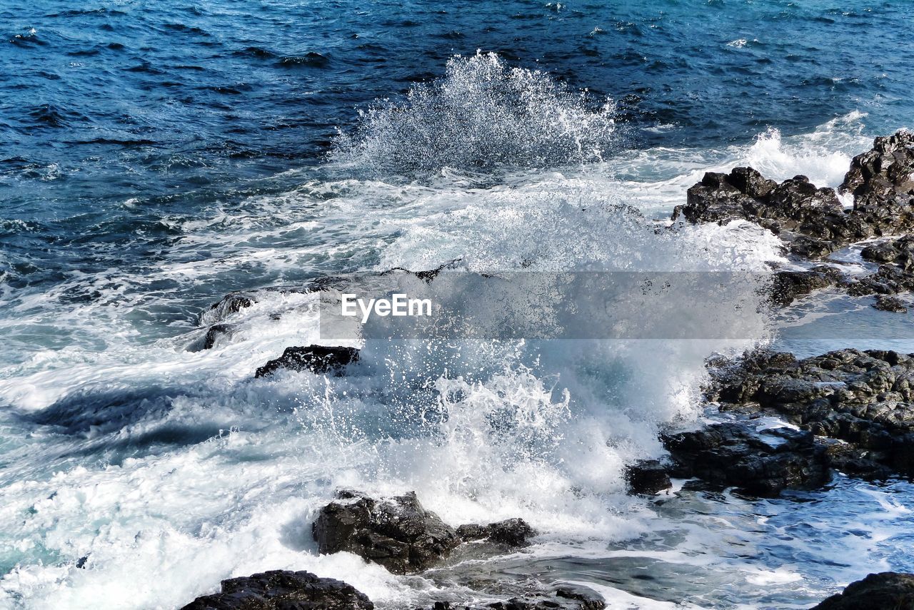 Waves splashing on rocks