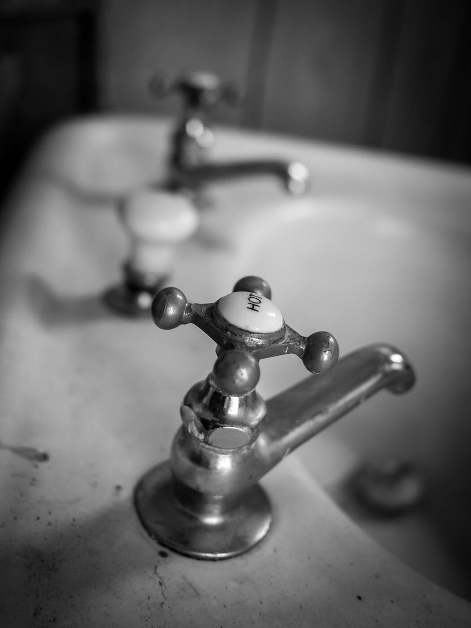 Close-up of faucet at sink in bathroom
