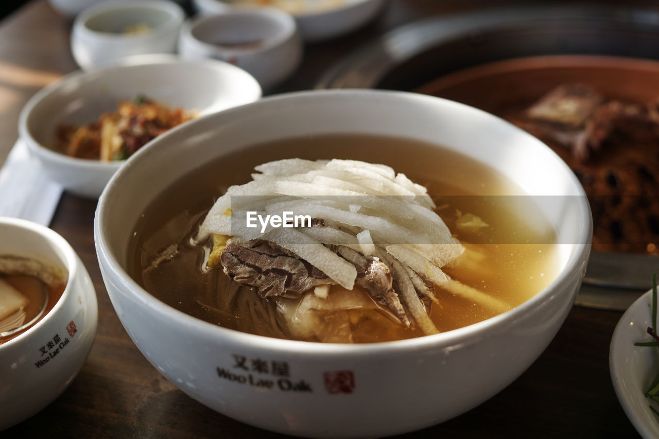 CLOSE-UP OF SOUP IN BOWLS