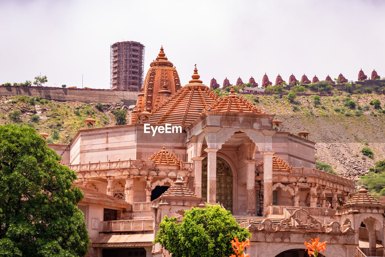 Artistic red stone jain temple at morning from unique angle