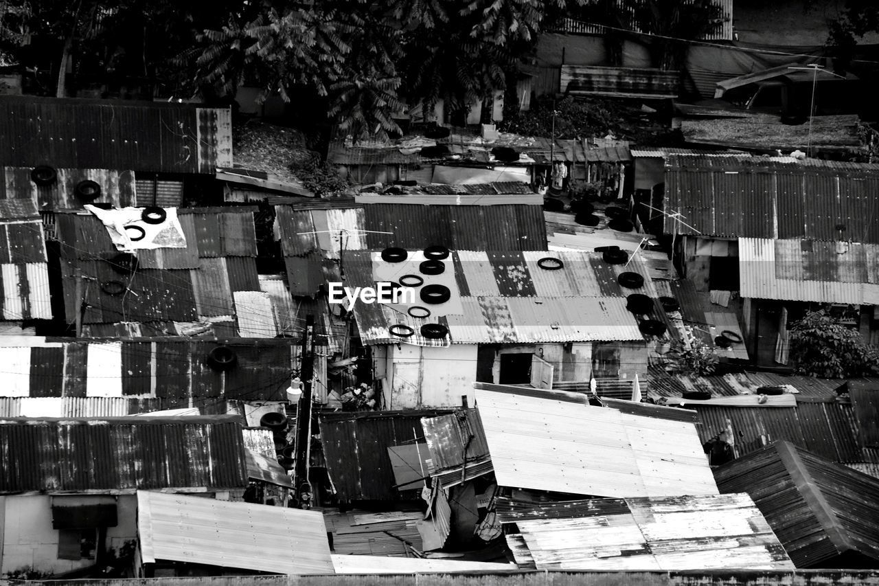 STACK OF STREET MARKET AGAINST BUILDINGS