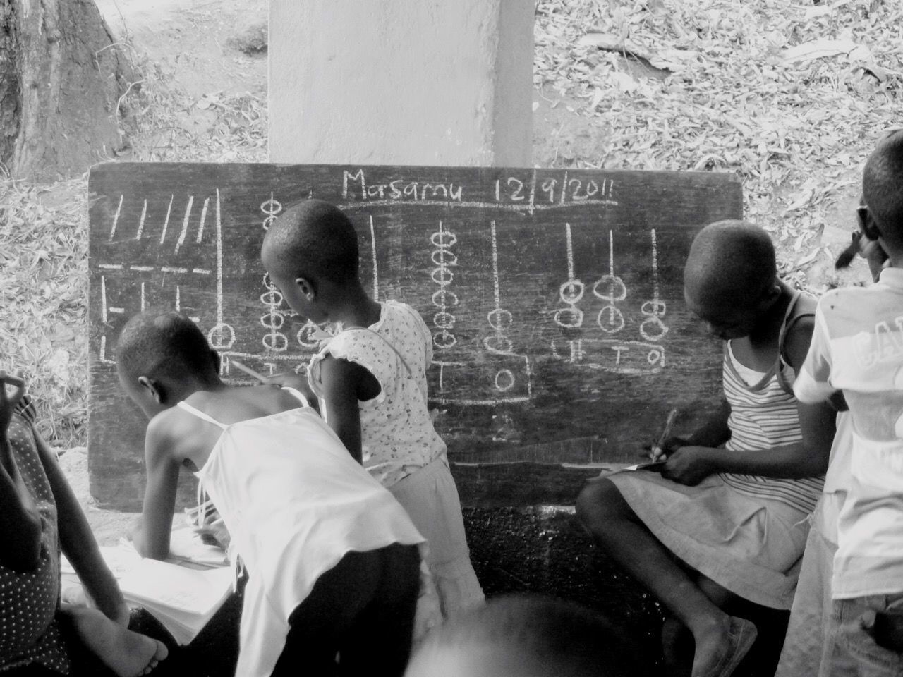 WOMAN SITTING ON CHAIR