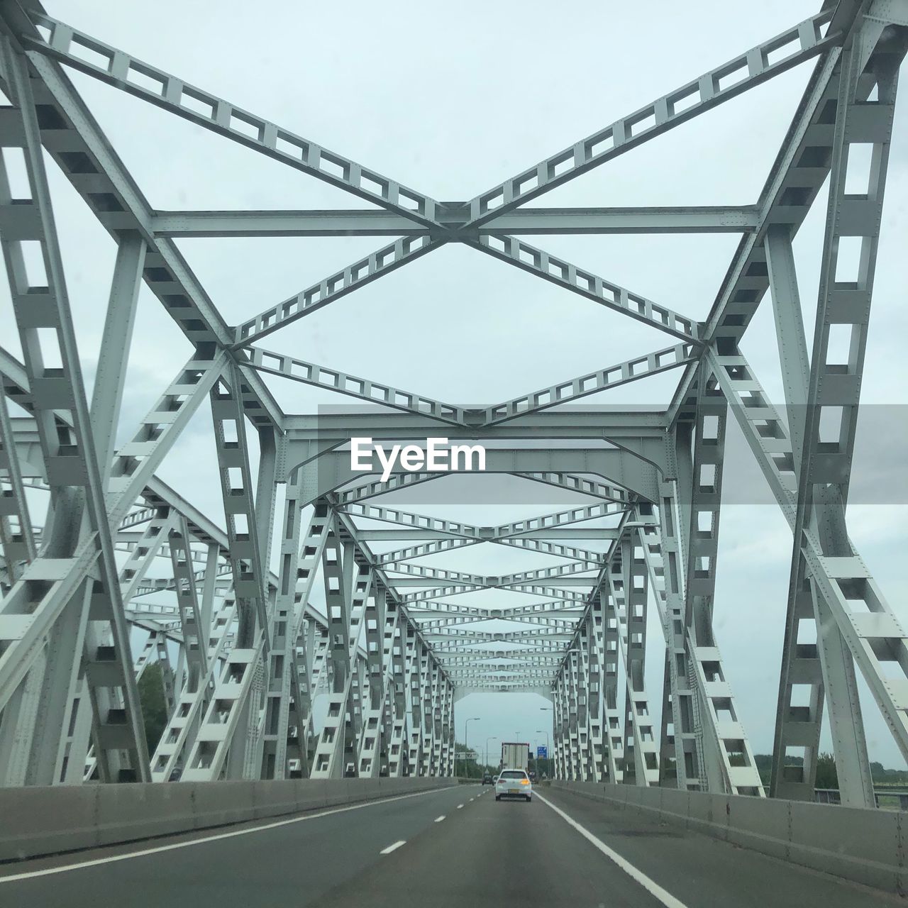 LOW ANGLE VIEW OF BRIDGE AGAINST SKY IN CITY