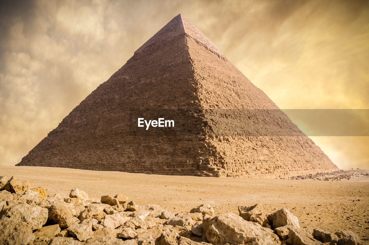 View the giza pyramid against beautiful sunset sky