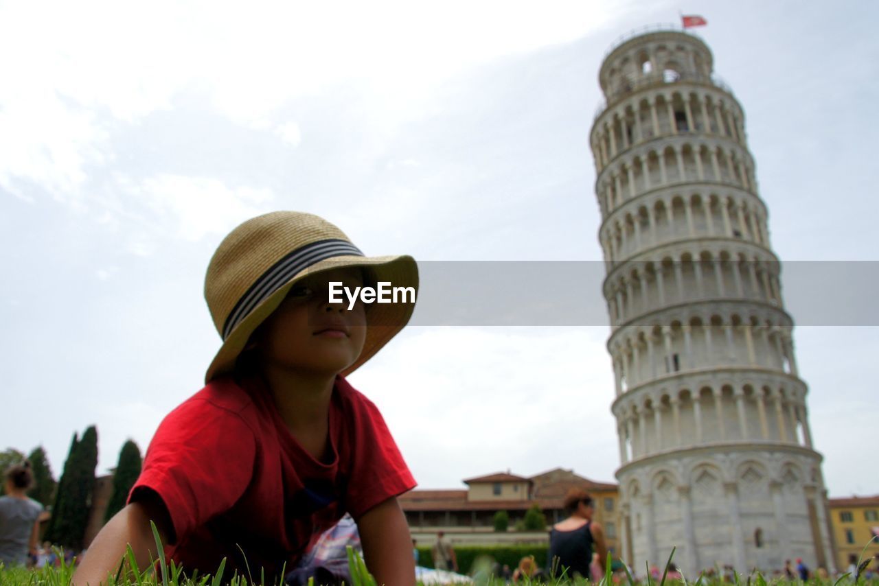 Boy by leaning tower of pisa