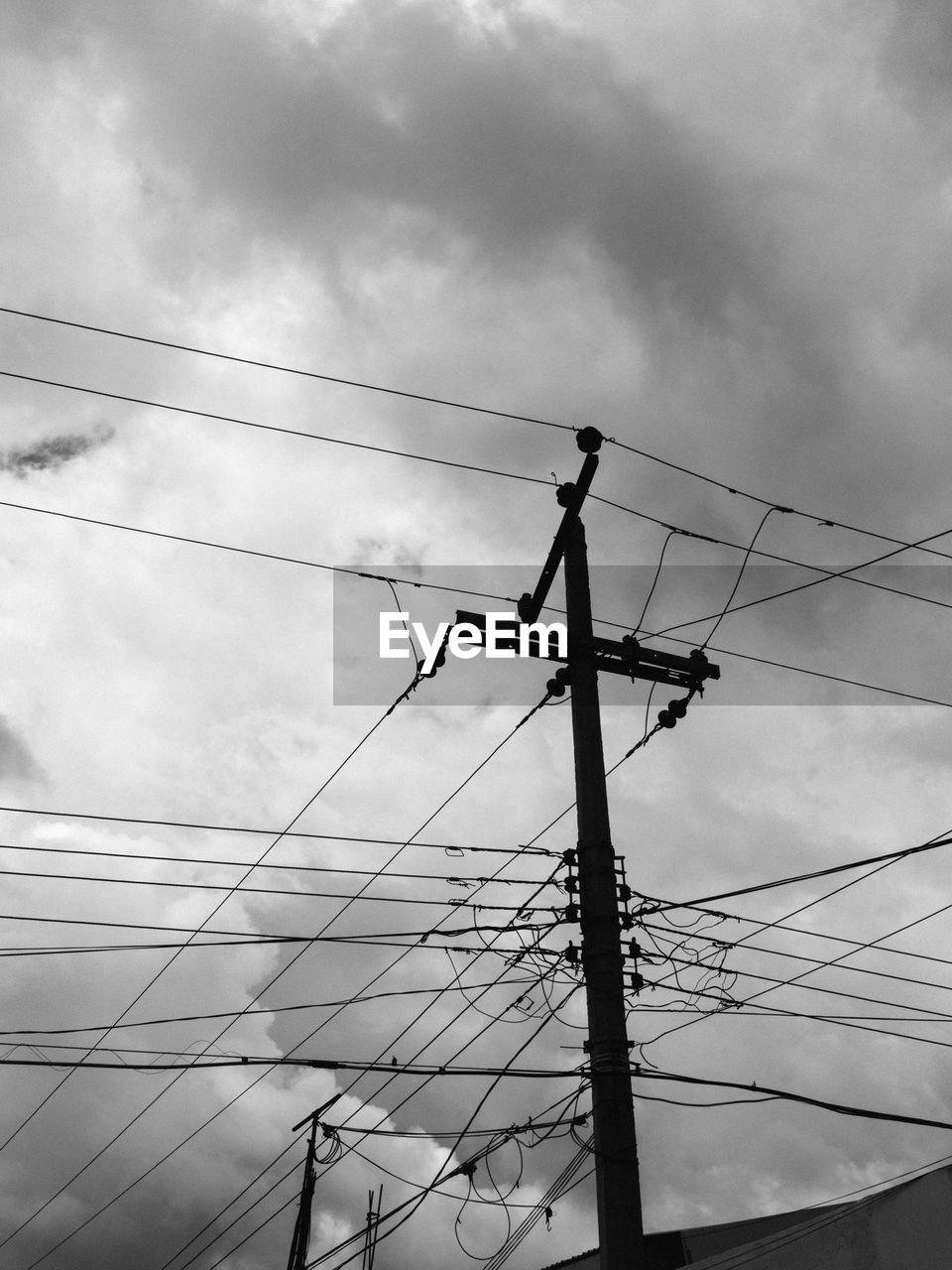 Low angle view of power lines against sky