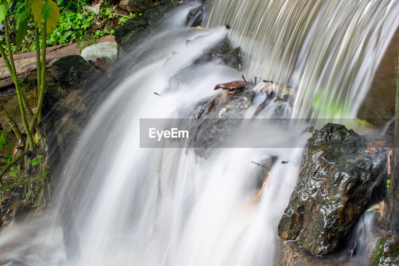 waterfall, water, beauty in nature, scenics - nature, nature, environment, body of water, motion, plant, watercourse, forest, long exposure, land, rock, tropical climate, tree, travel destinations, water feature, river, outdoors, stream, flowing, travel, water resources, no people, tourism, flowing water, non-urban scene, speed, blurred motion, landscape, sports, rainforest, autumn