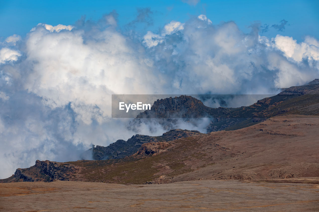 Panoramic view of volcanic landscape against sky