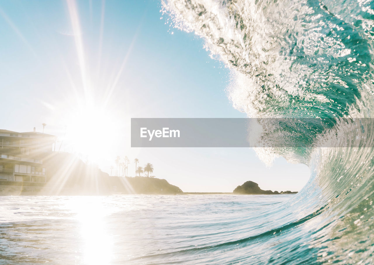 Panoramic view of sea against sky on sunny day