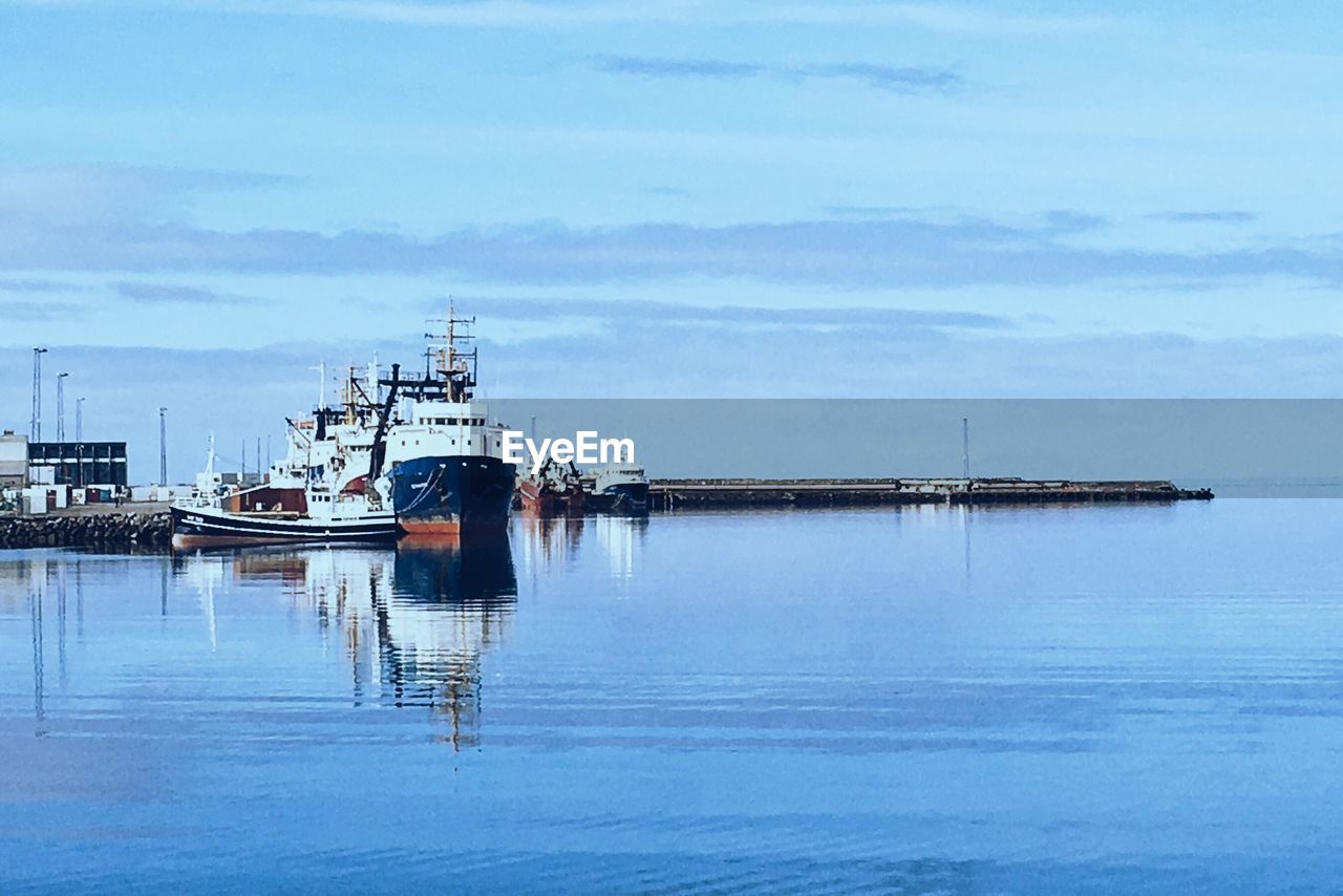 Ships moored at harbor