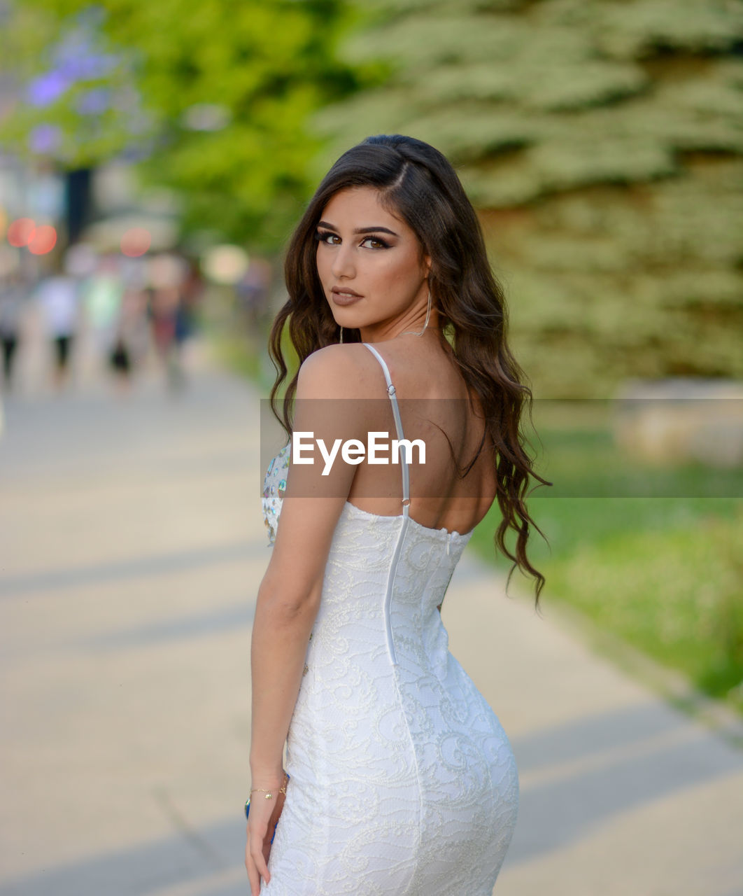 Portrait of beautiful young woman standing outdoors