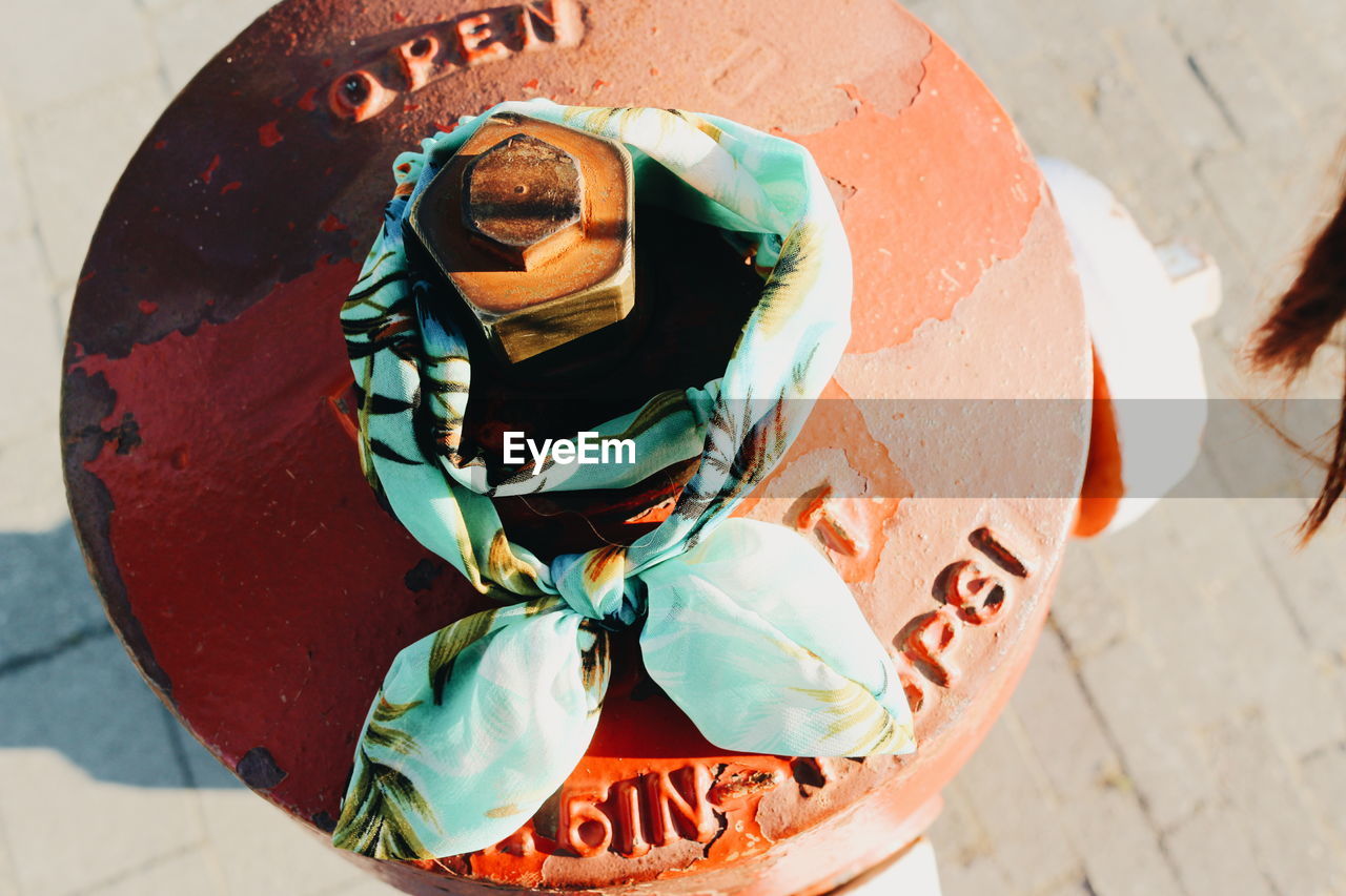 High angle view of fabric tied up on metal