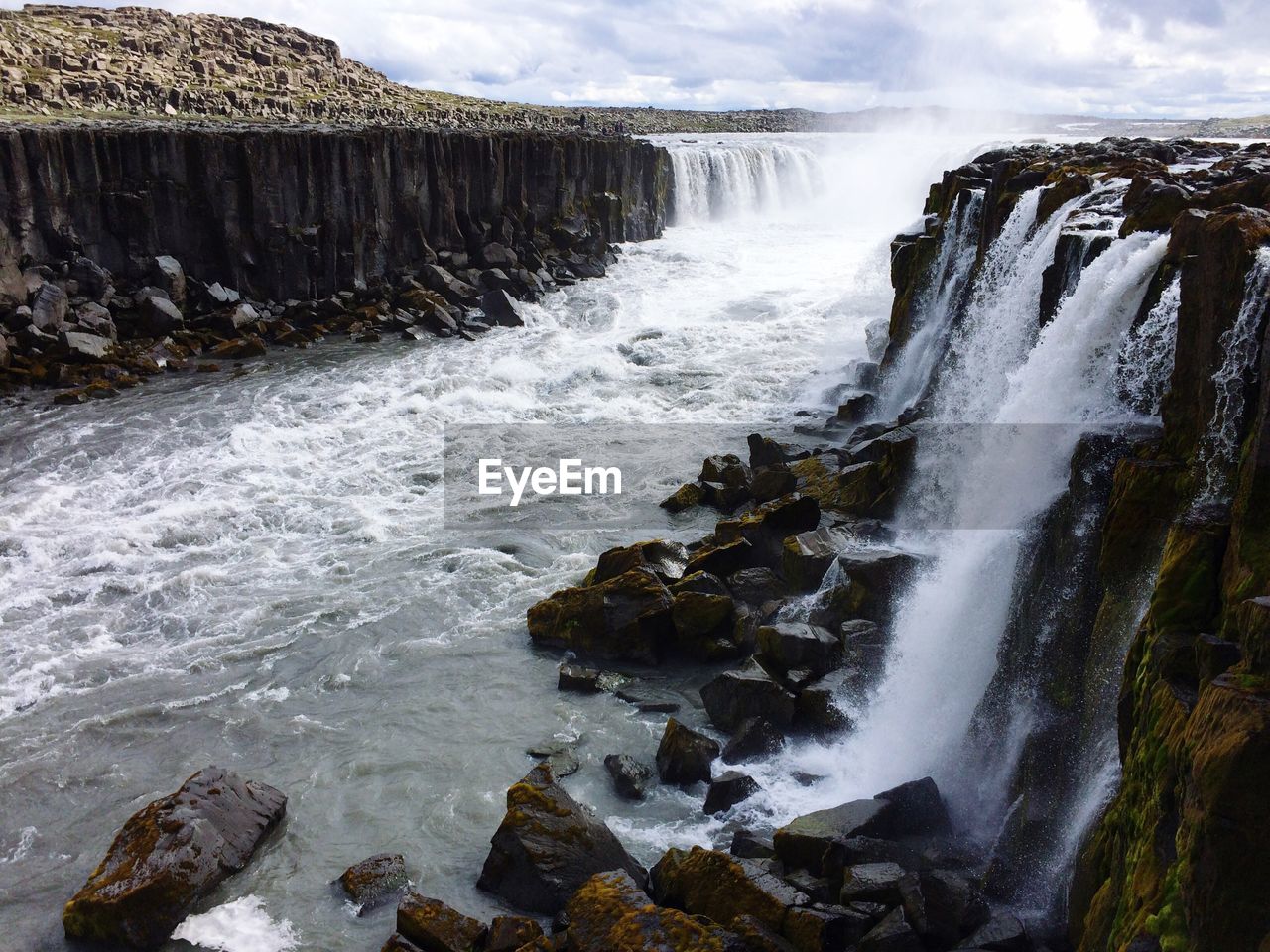 SCENIC VIEW OF WATERFALL AT SEA