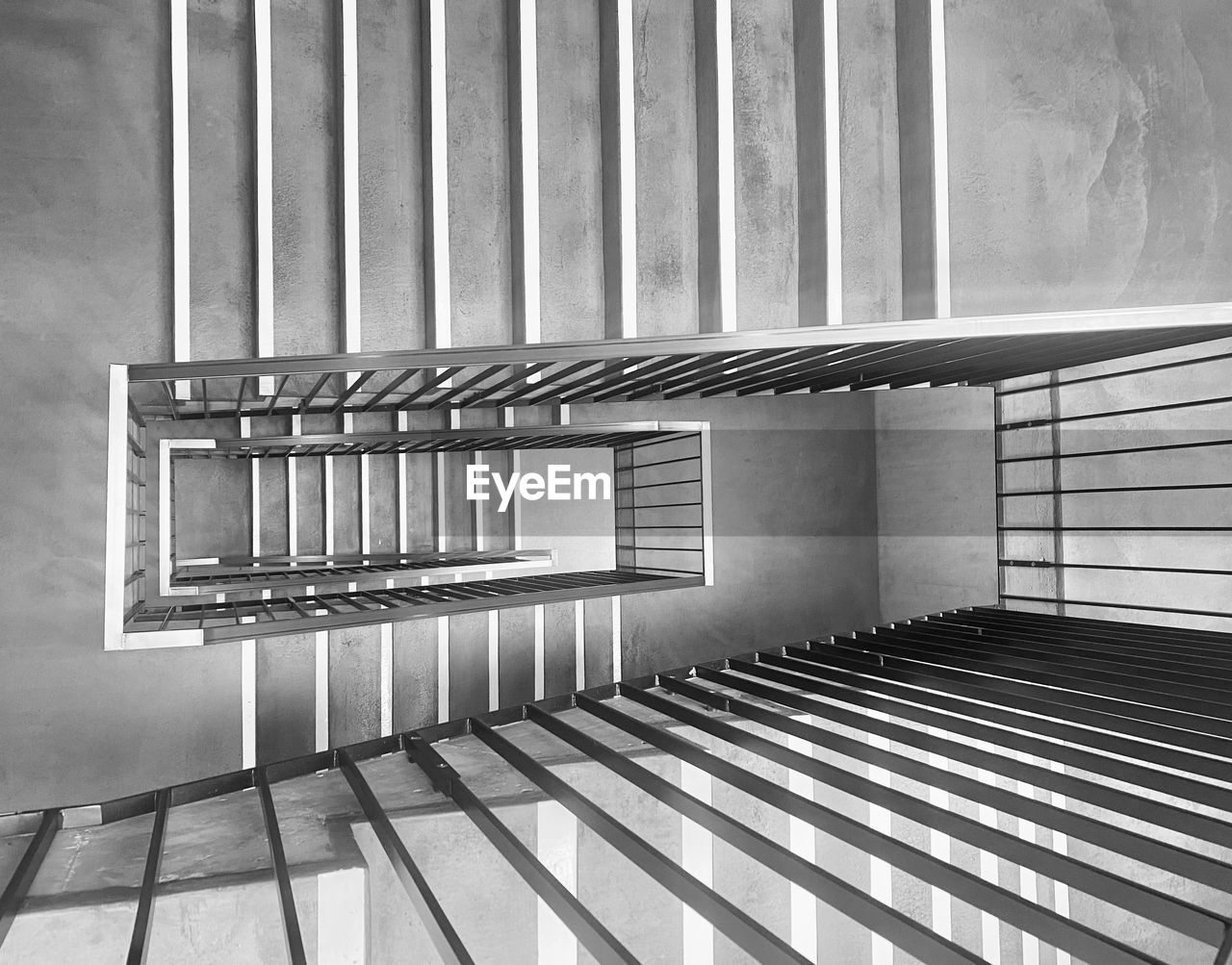 stairs, architecture, staircase, railing, steps and staircases, indoors, black and white, interior design, built structure, no people, monochrome photography, line, monochrome, pattern, building, metal, handrail, spiral staircase, white, spiral, iron, day, furniture, wall - building feature, house