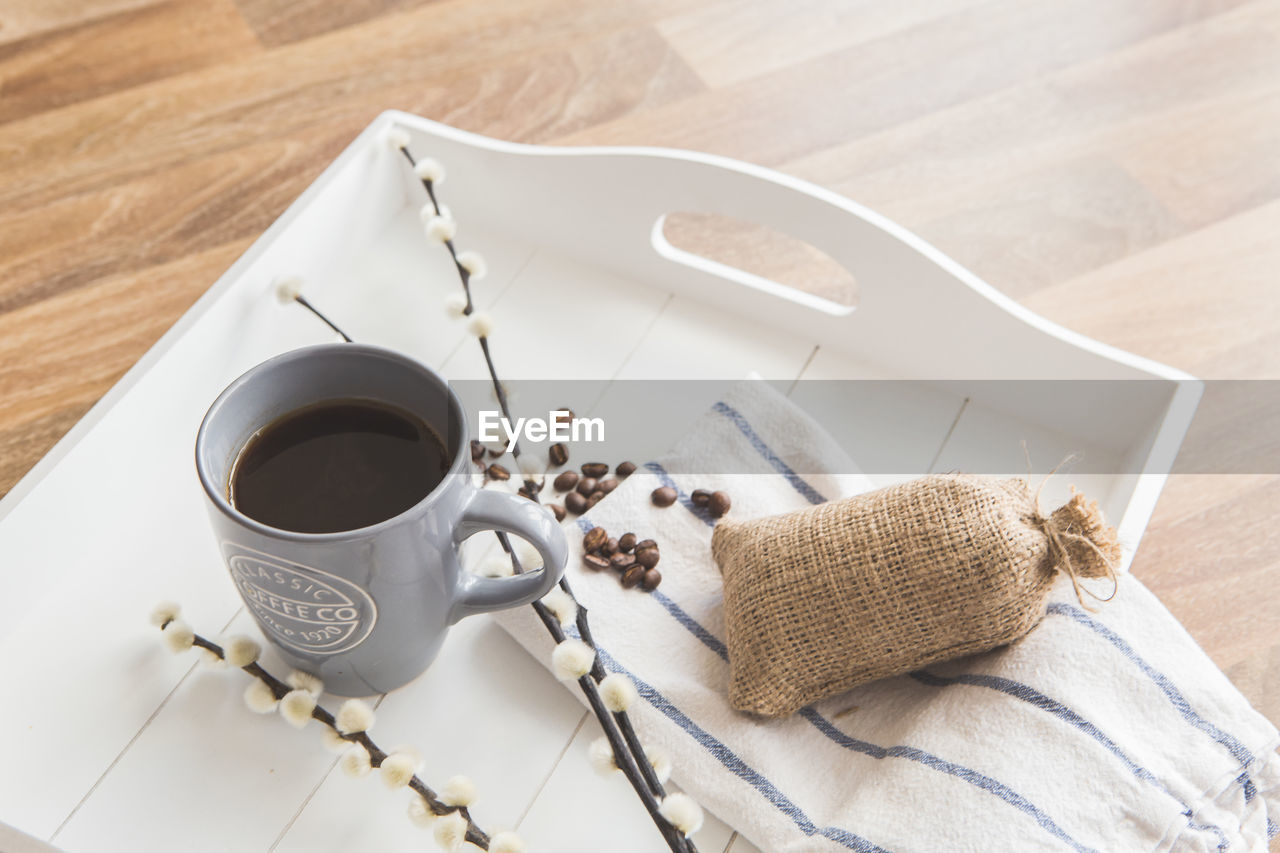 High angle view of coffee cup on table