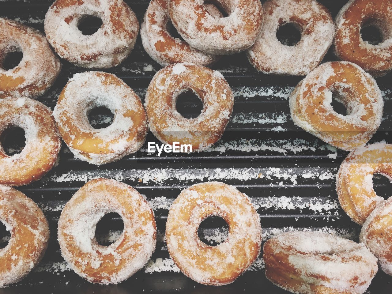 Directly above shot of donuts on baking sheet