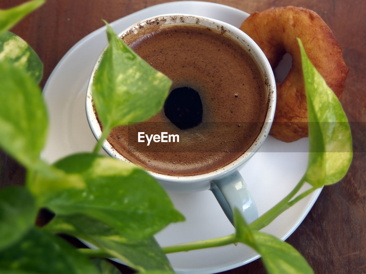 Close-up of coffee and spoon on table