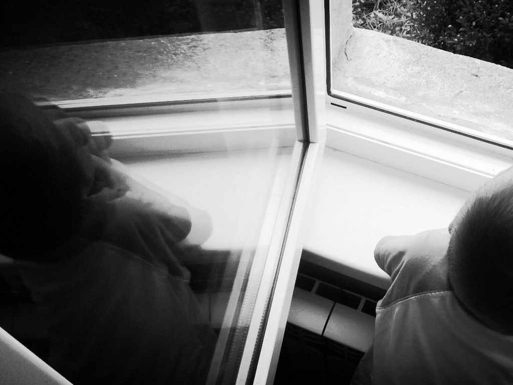 REAR VIEW OF WOMAN SITTING IN TUNNEL