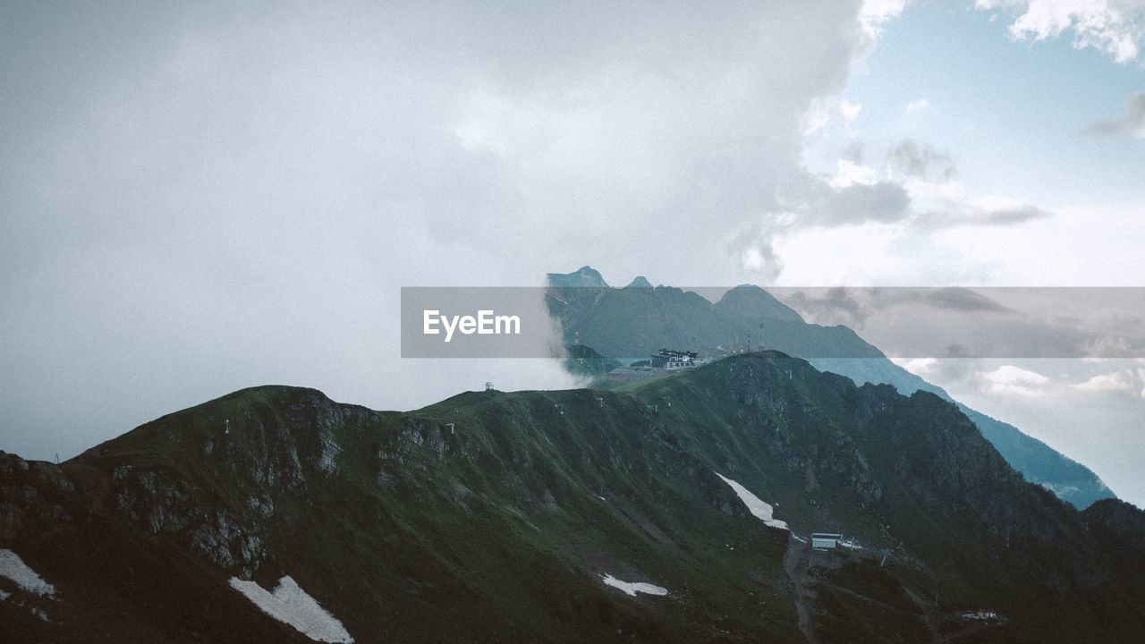 Scenic view of snowcapped mountains against sky