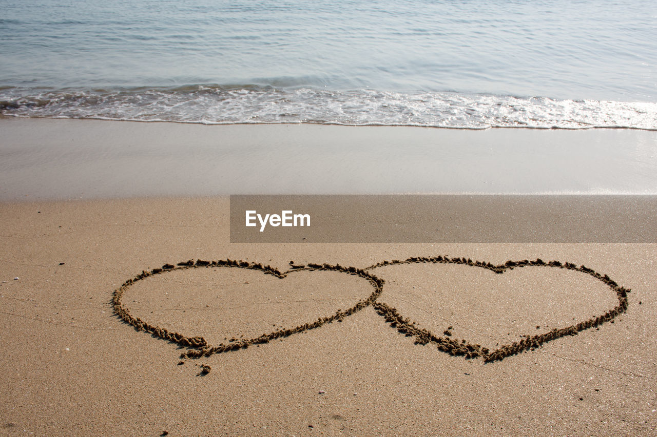 Heart shape on sand at beach